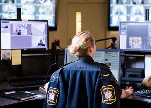 Corrections Officer looking at screens