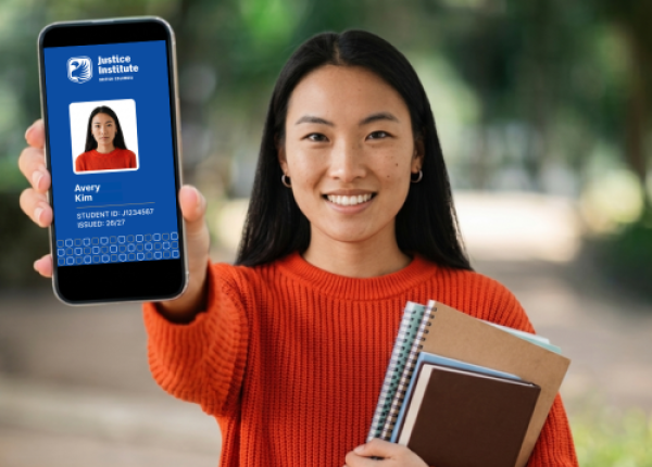 Student holds a phone showing her digital student ID card